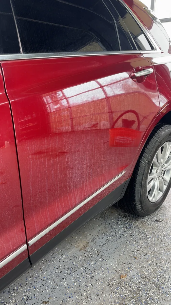 Red SUV door and rear quarter, gloss finish