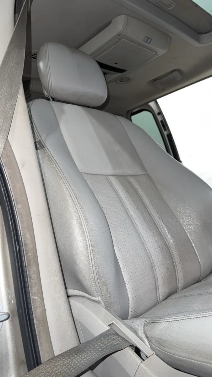 Cleaned light grey leather front seat