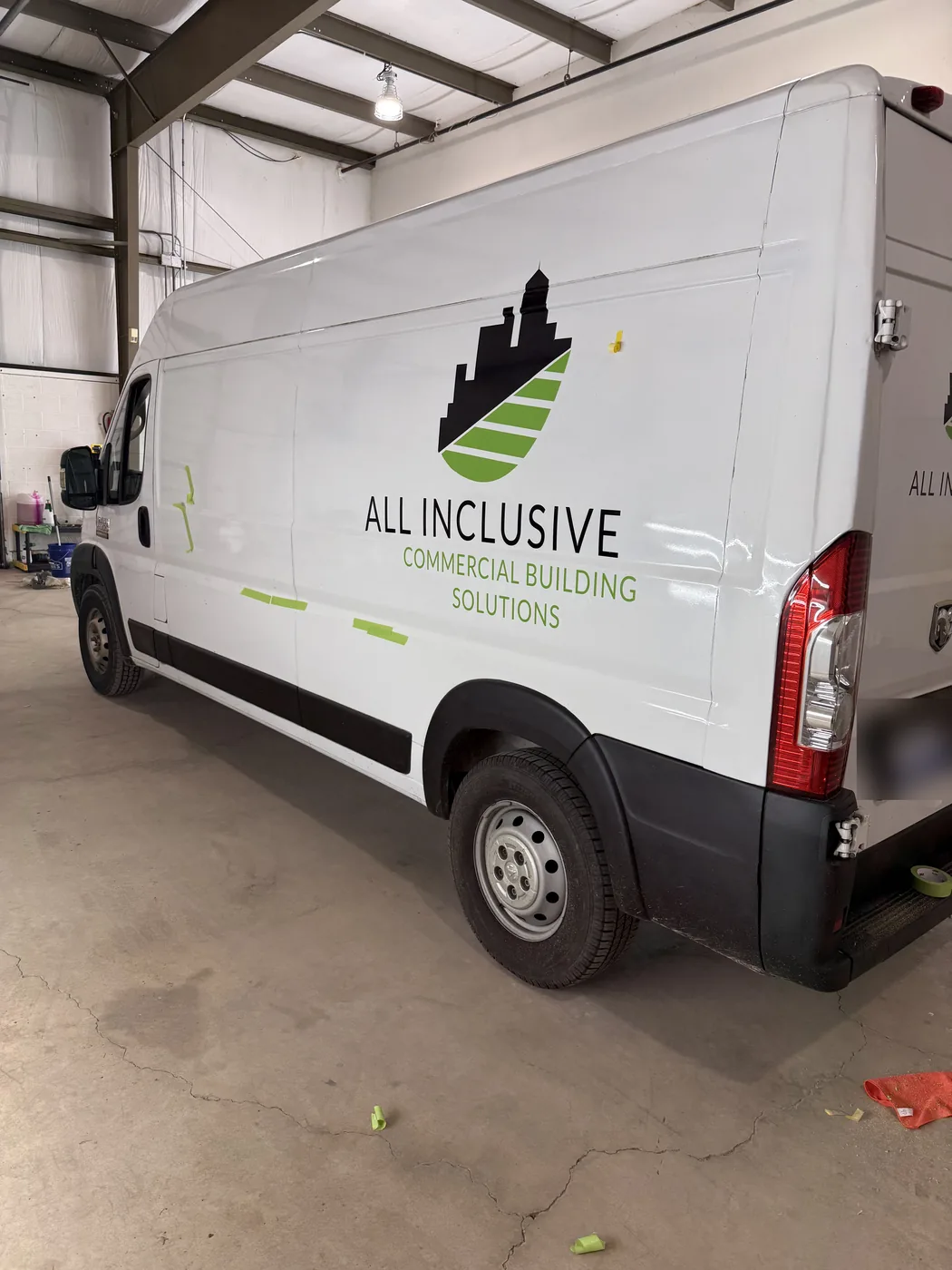 White All Inclusive Commercial Building Solutions van in the A2 Auto Works bay